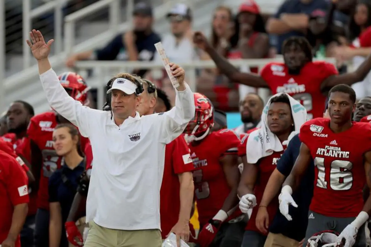 Lane Kiffin Celebrates Win With Jaxson Dart and Lola Sexton